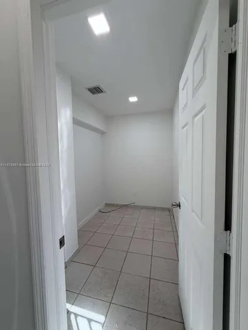 a bathroom with a shower and a toilet