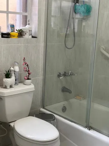 an entryway space with a hallway