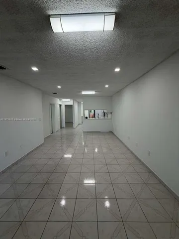 a kitchen with cabinets stainless steel appliances and sink