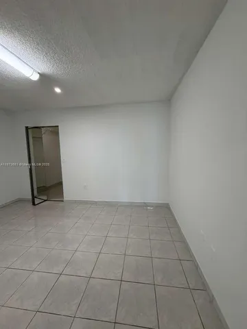 a white toilet sitting next to a bath tub shower