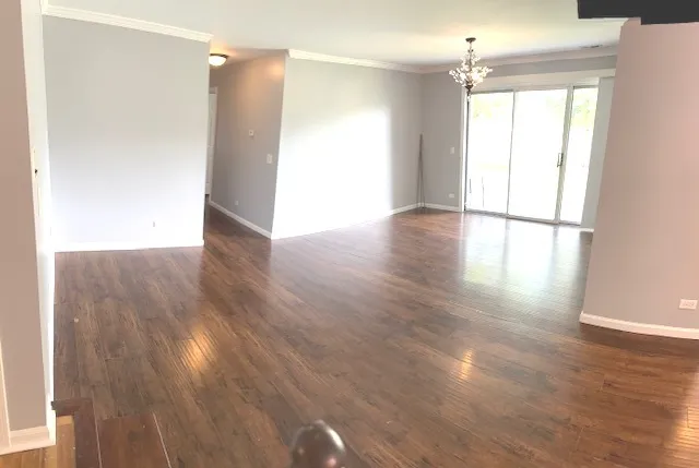 a view of a livingroom with wooden floor