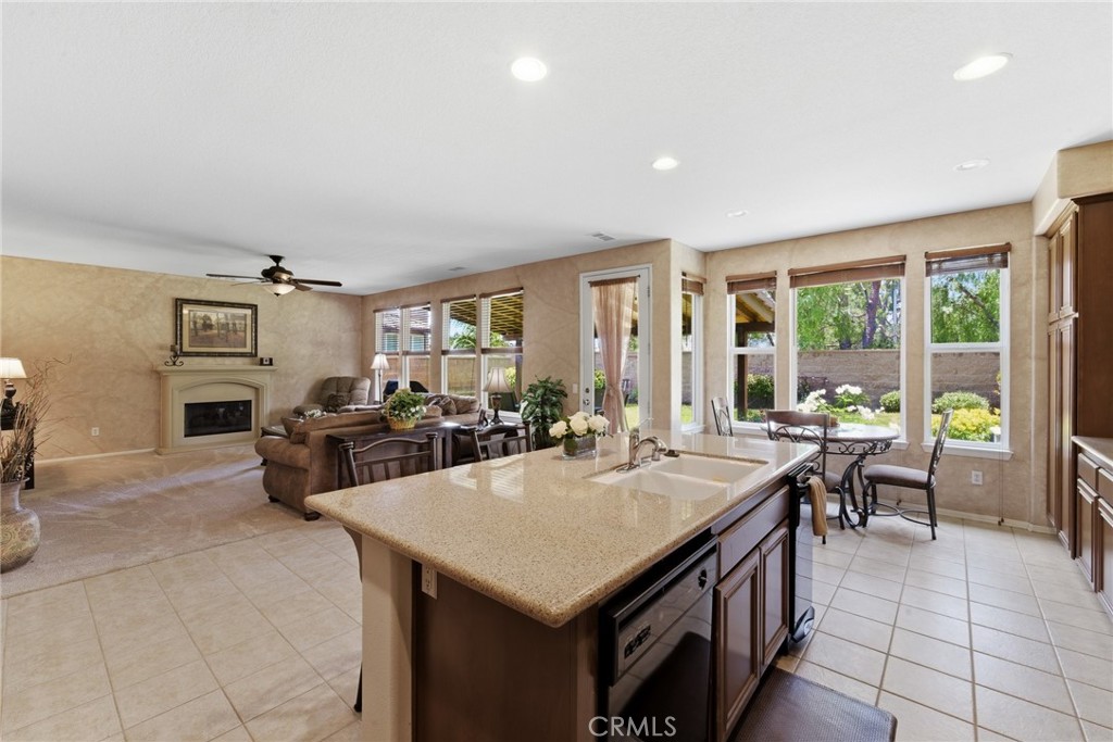 11515 Venezia Way Porter Ranch, CA 91326 - Photo 13 of 41 Great room open to island and kitchen