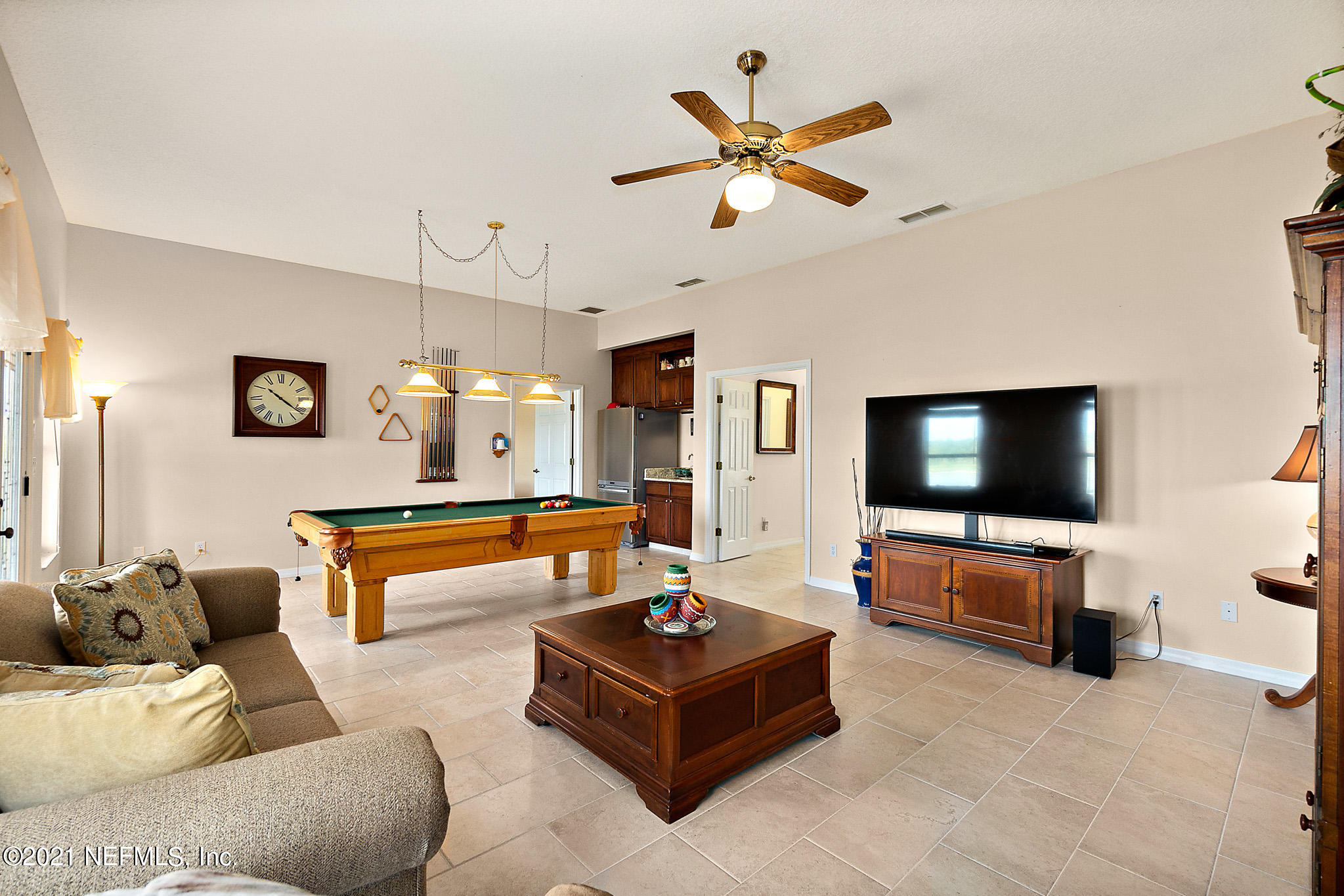 9269 July Lane St. Augustine, FL 32080 - Photo 11 of 105 a living room with furniture and a flat screen tv