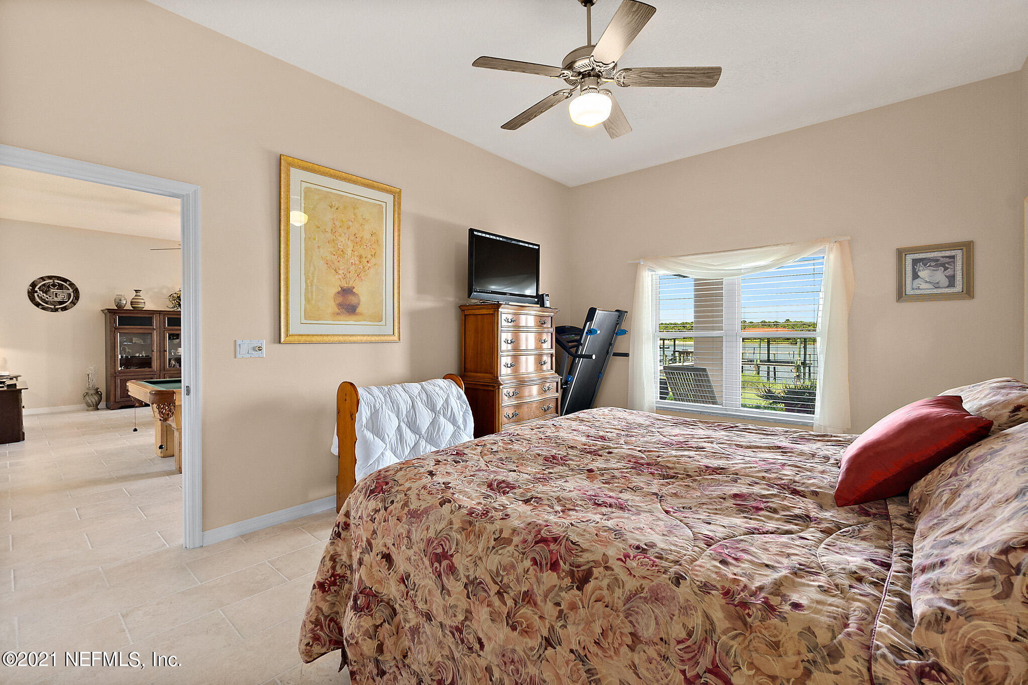 9269 July Lane St. Augustine, FL 32080 - Photo 18 of 105 a bedroom with a bed and a flat screen tv