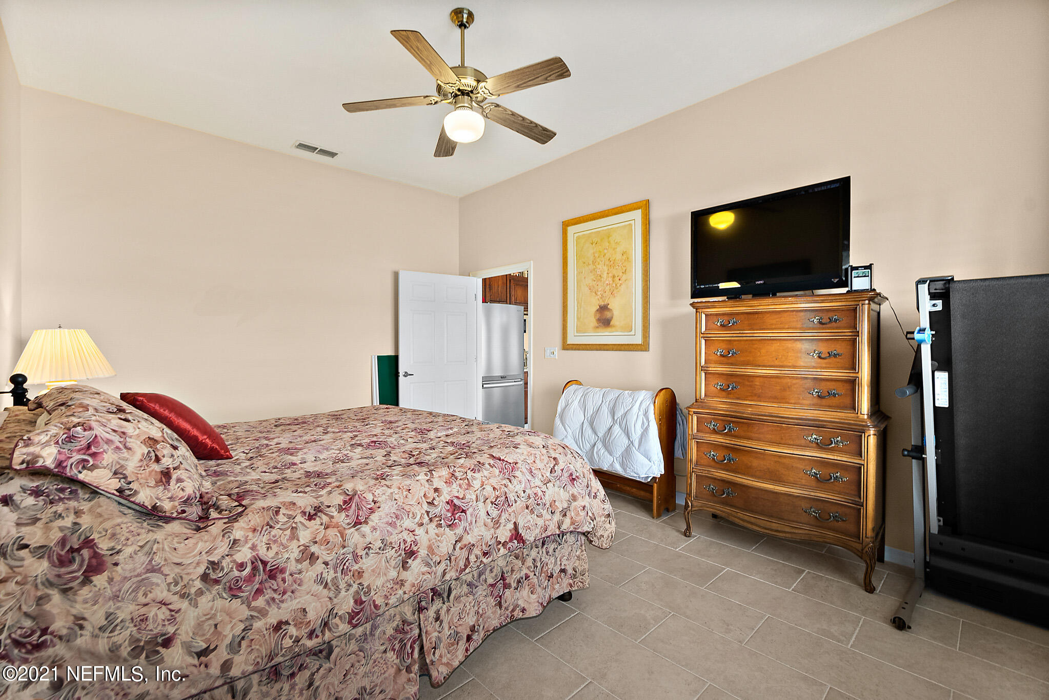 9269 July Lane St. Augustine, FL 32080 - Photo 19 of 105 a bedroom with a bed and a flat screen tv
