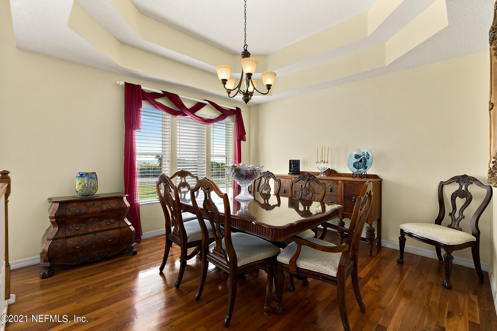 9269 July Lane St. Augustine, FL 32080 - Photo 21 of 105 a view of a dining room with furniture window and wooden floor