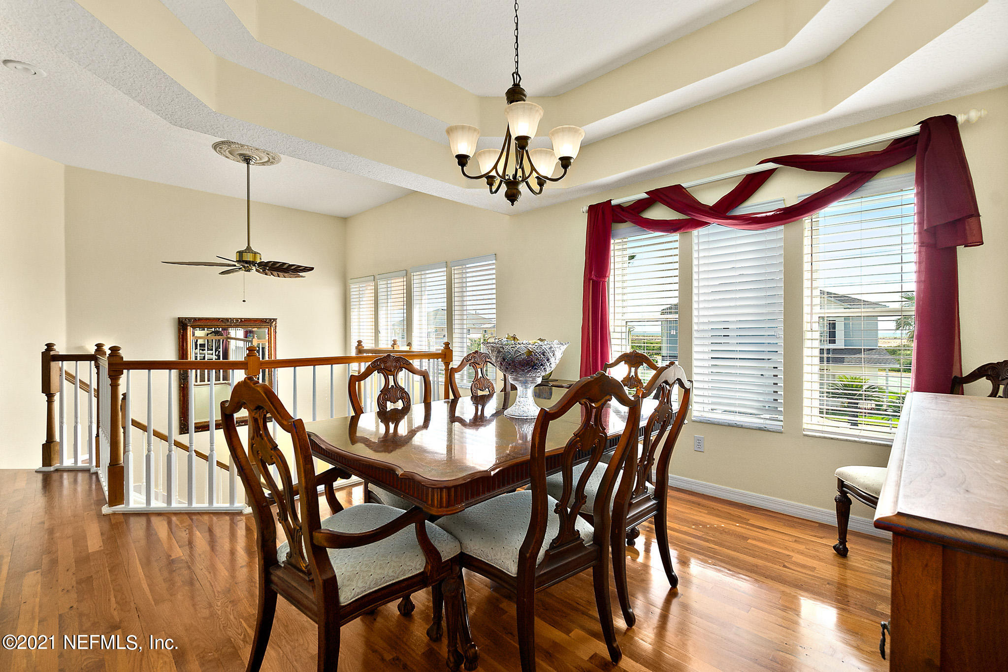 9269 July Lane St. Augustine, FL 32080 - Photo 22 of 105 a view of a dining room with furniture window and wooden floor