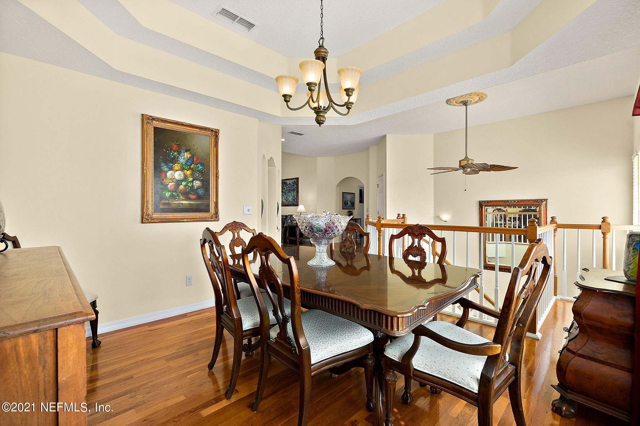 9269 July Lane St. Augustine, FL 32080 - Photo 23 of 105 a view of a dining room with furniture wooden floor and chandelier