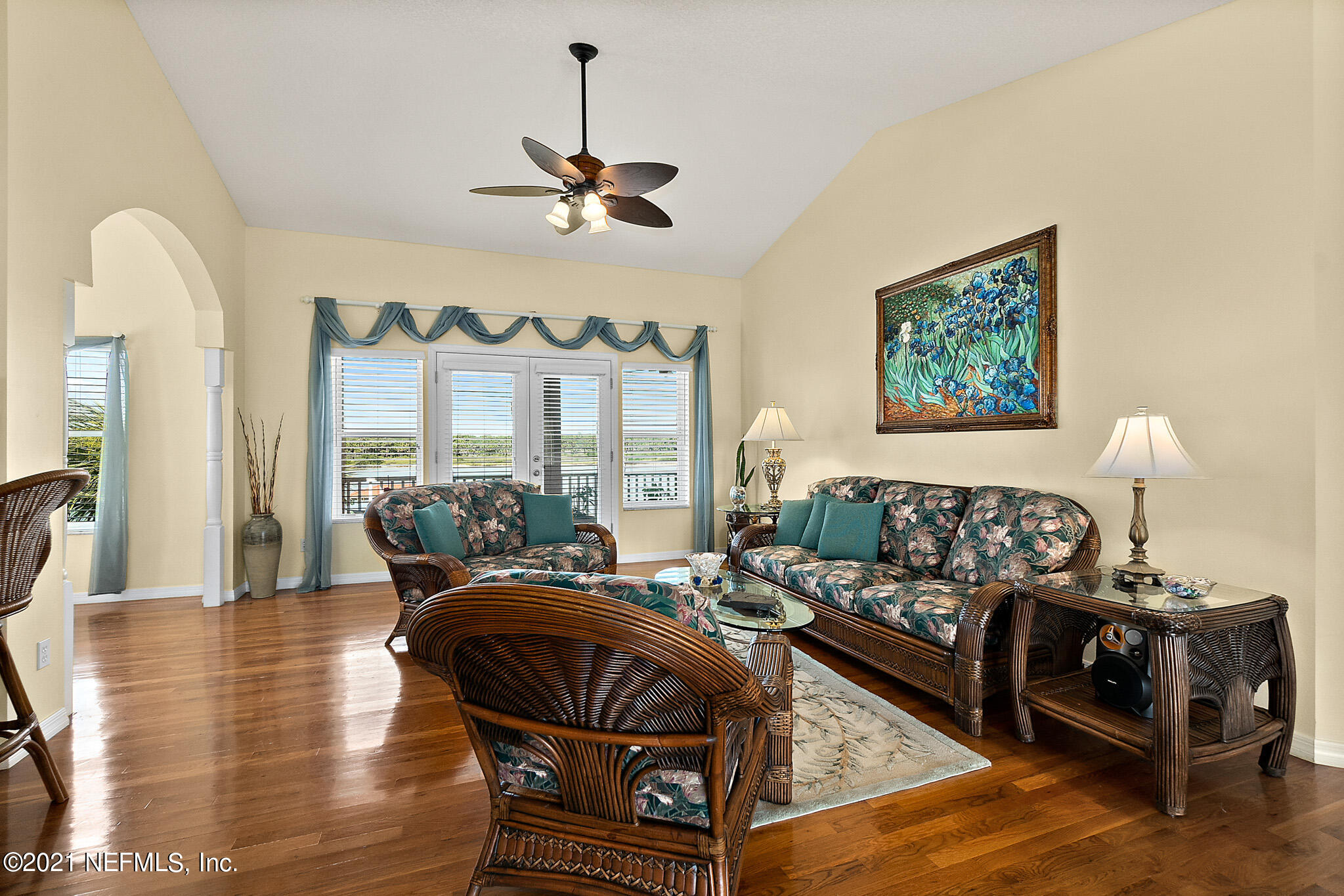 9269 July Lane St. Augustine, FL 32080 - Photo 26 of 105 a living room with furniture a chandelier and a wooden floor