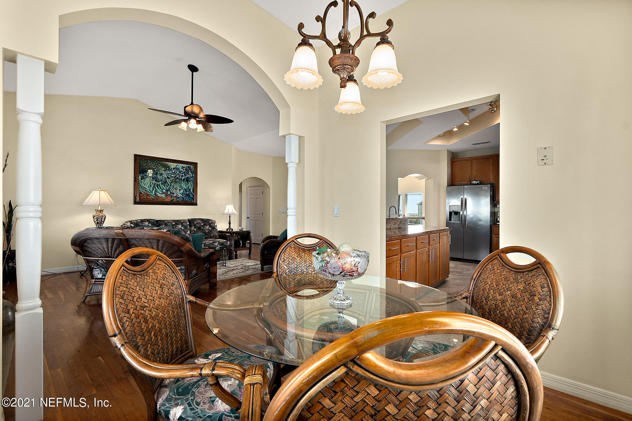 9269 July Lane St. Augustine, FL 32080 - Photo 31 of 105 a living room with furniture a chandelier and a mirror