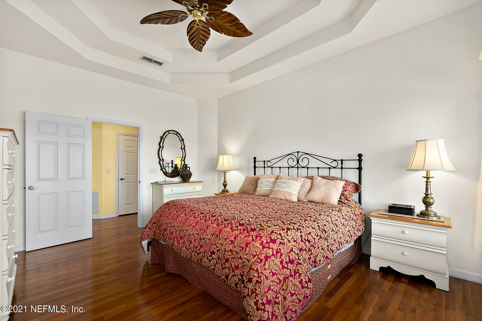 9269 July Lane St. Augustine, FL 32080 - Photo 40 of 105 a bedroom with a bed and wooden floor