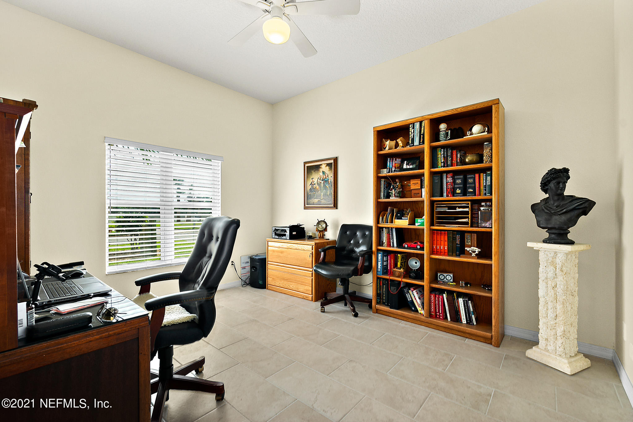 9269 July Lane St. Augustine, FL 32080 - Photo 4 of 105 a view of a workspace with furniture and a window
