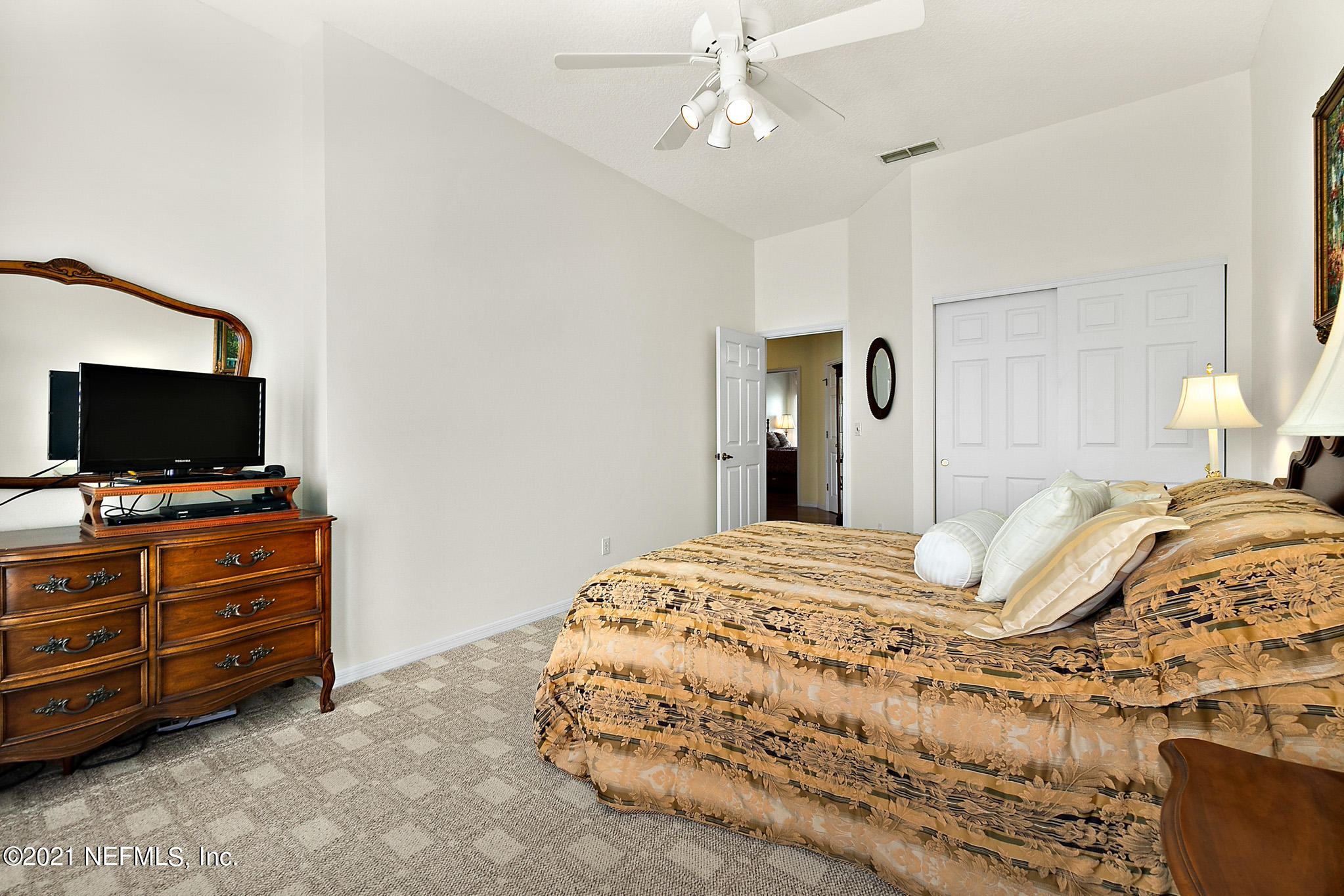 9269 July Lane St. Augustine, FL 32080 - Photo 51 of 105 a bedroom with a bed and flat screen tv