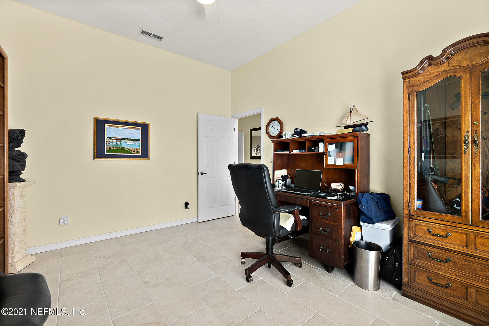 9269 July Lane St. Augustine, FL 32080 - Photo 6 of 105 a view of a workspace with furniture and a window