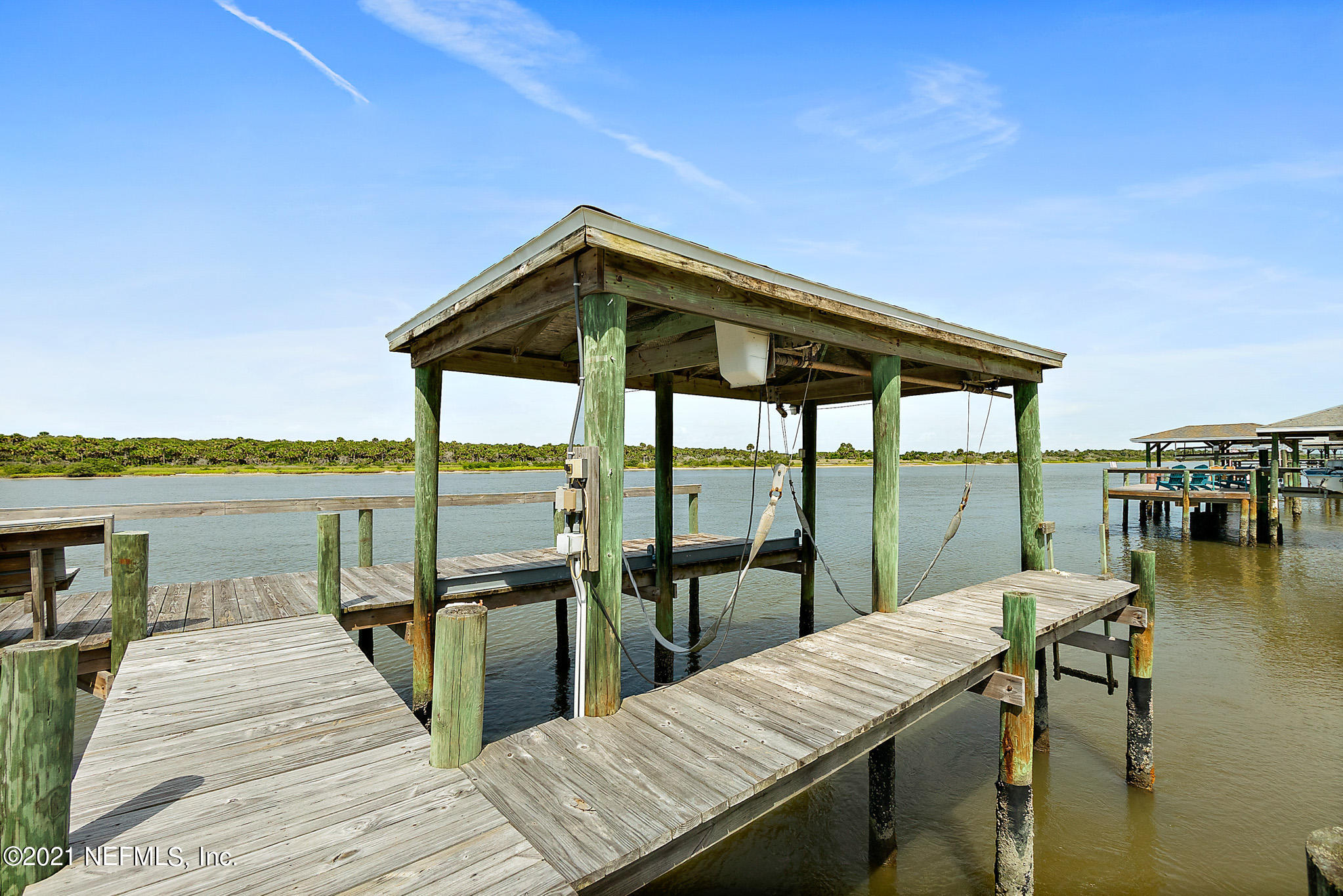 9269 July Lane St. Augustine, FL 32080 - Photo 65 of 105 a view of a balcony with lake view and a floor to ceiling window