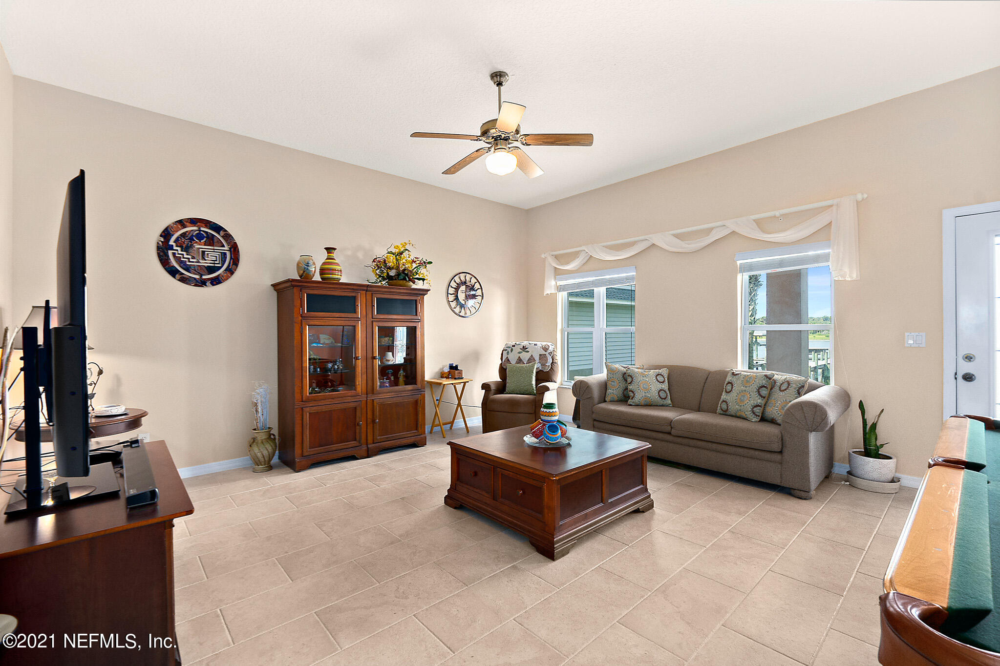 9269 July Lane St. Augustine, FL 32080 - Photo 9 of 105 a living room with furniture and a large window