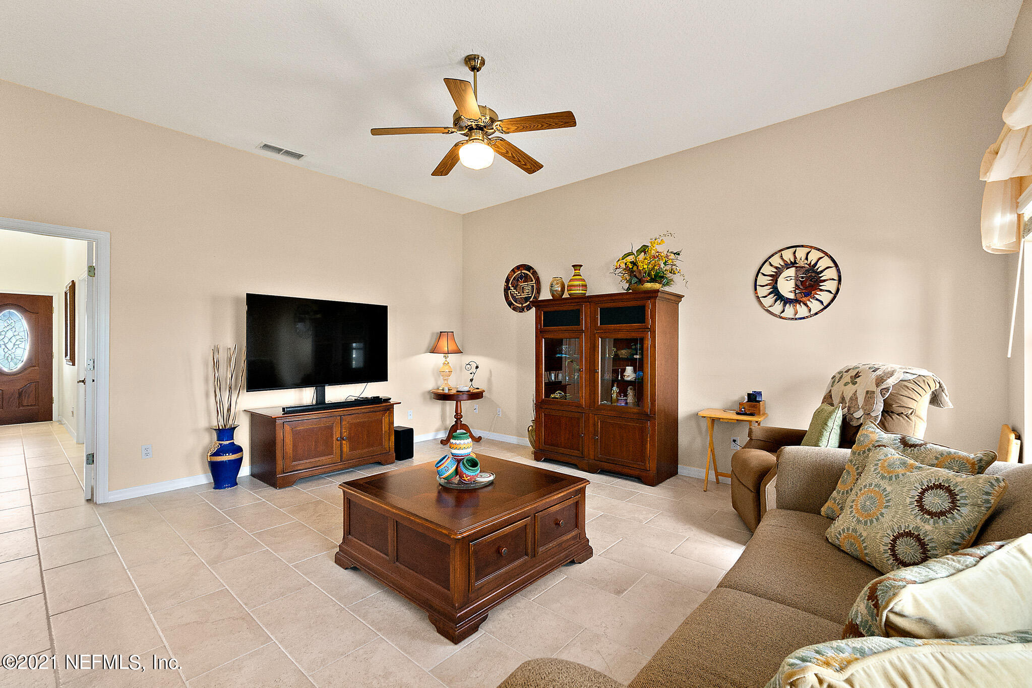 9269 July Lane St. Augustine, FL 32080 - Photo 10 of 105 a living room with furniture and a flat screen tv