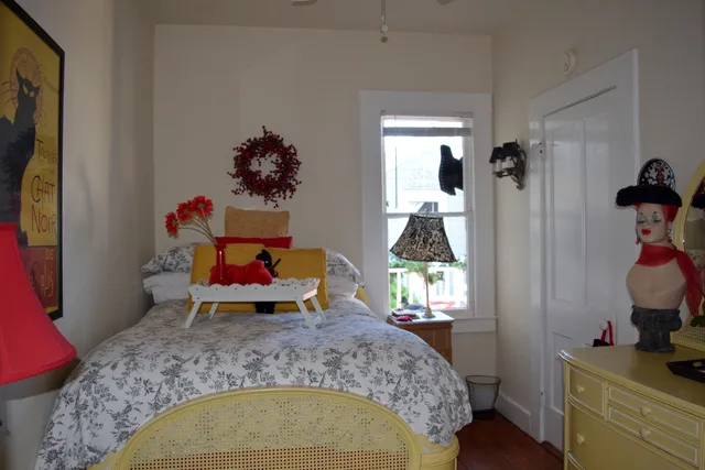 a bedroom with a bed and dresser