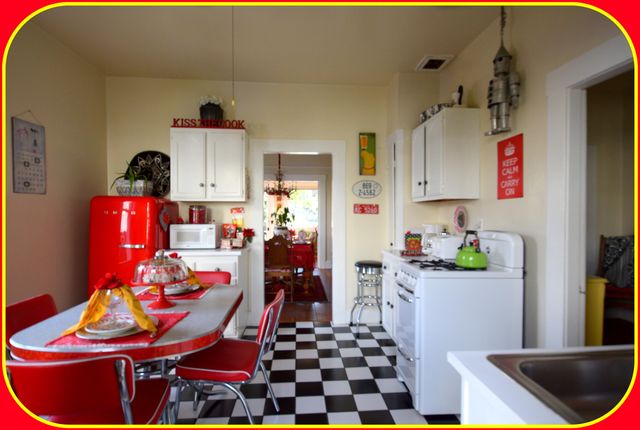 a kitchen with stainless steel appliances kitchen island granite countertop a sink and cabinets