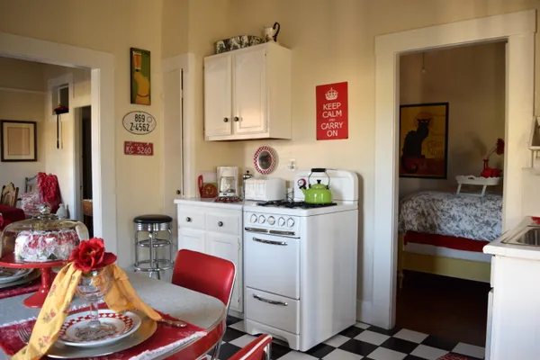 a kitchen with stainless steel appliances kitchen island granite countertop a sink and cabinets