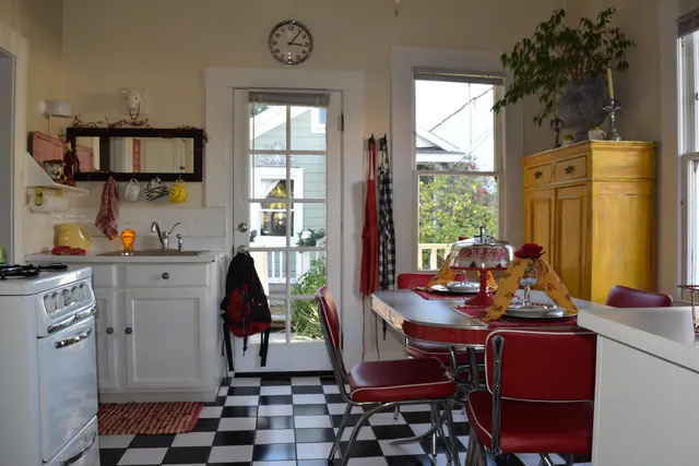 a room with furniture a rug and a window