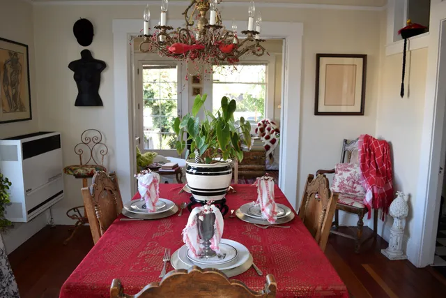 a living room with furniture a window and a chandelier