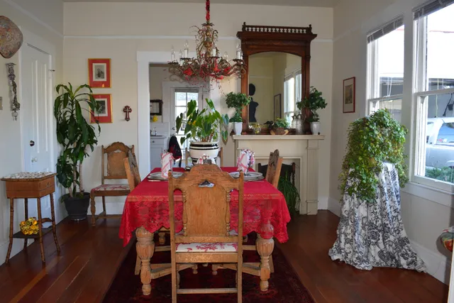 a view of a dining room with furniture and chandelier