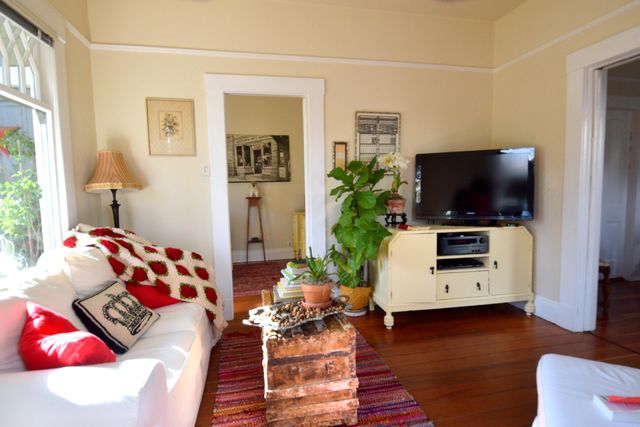 a living room with furniture and a flat screen tv