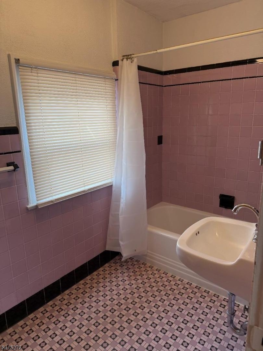 59 Walnut Street, Unit 1 Montclair, NJ 07042 - Photo 8 of 8 a bathroom with a bathtub and a shower
