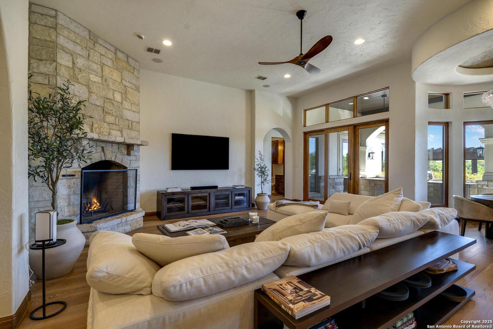 307 Augusta Boerne, TX 78006 - Photo 14 of 90 a living room with furniture fireplace and a flat screen tv