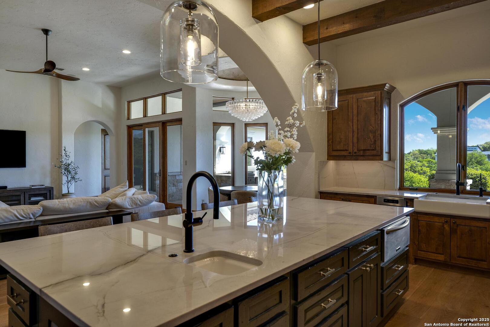 307 Augusta Boerne, TX 78006 - Photo 26 of 90 a kitchen with sink a counter and cabinets