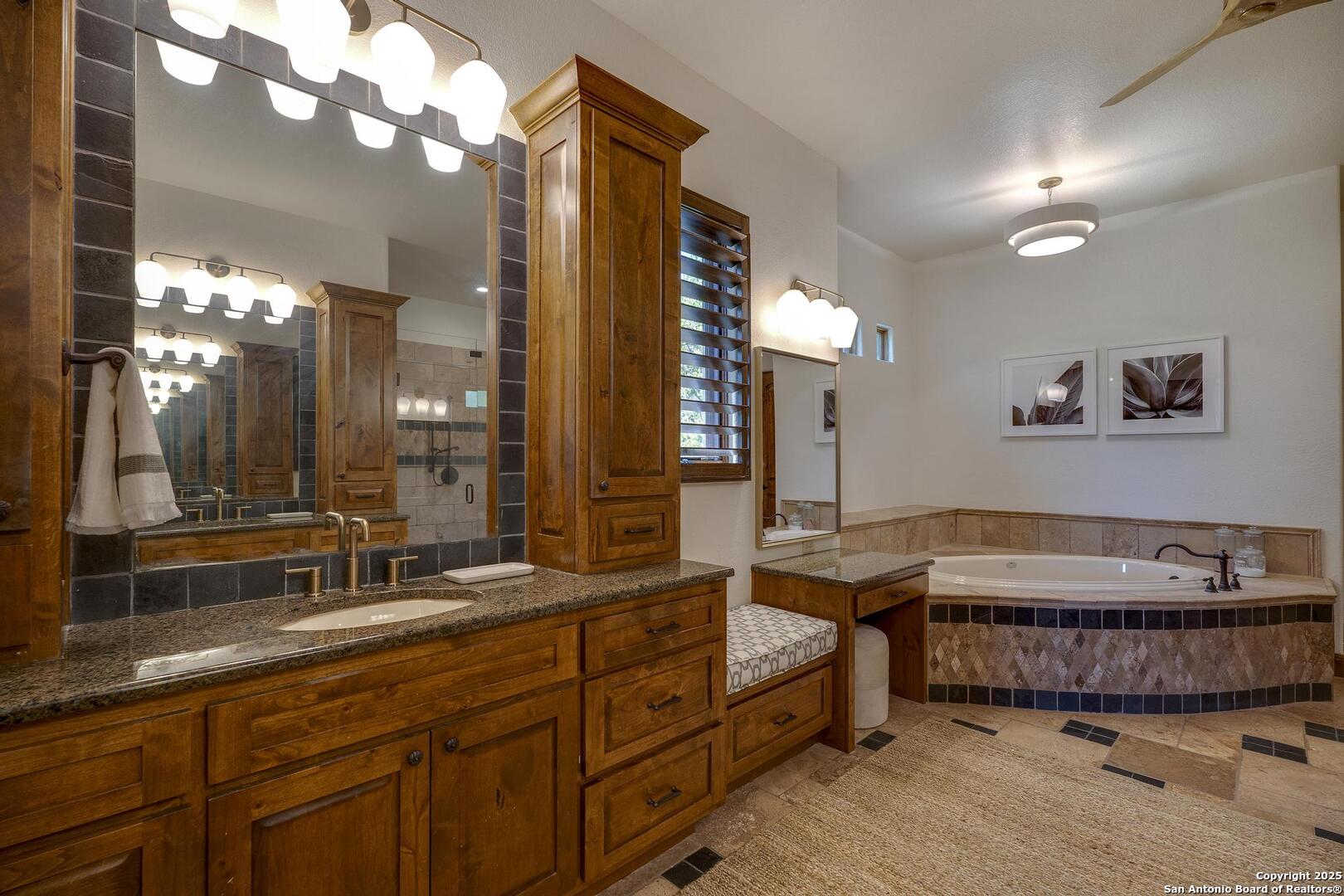 307 Augusta Boerne, TX 78006 - Photo 36 of 90 a spacious bathroom with a double vanity sink and a mirror