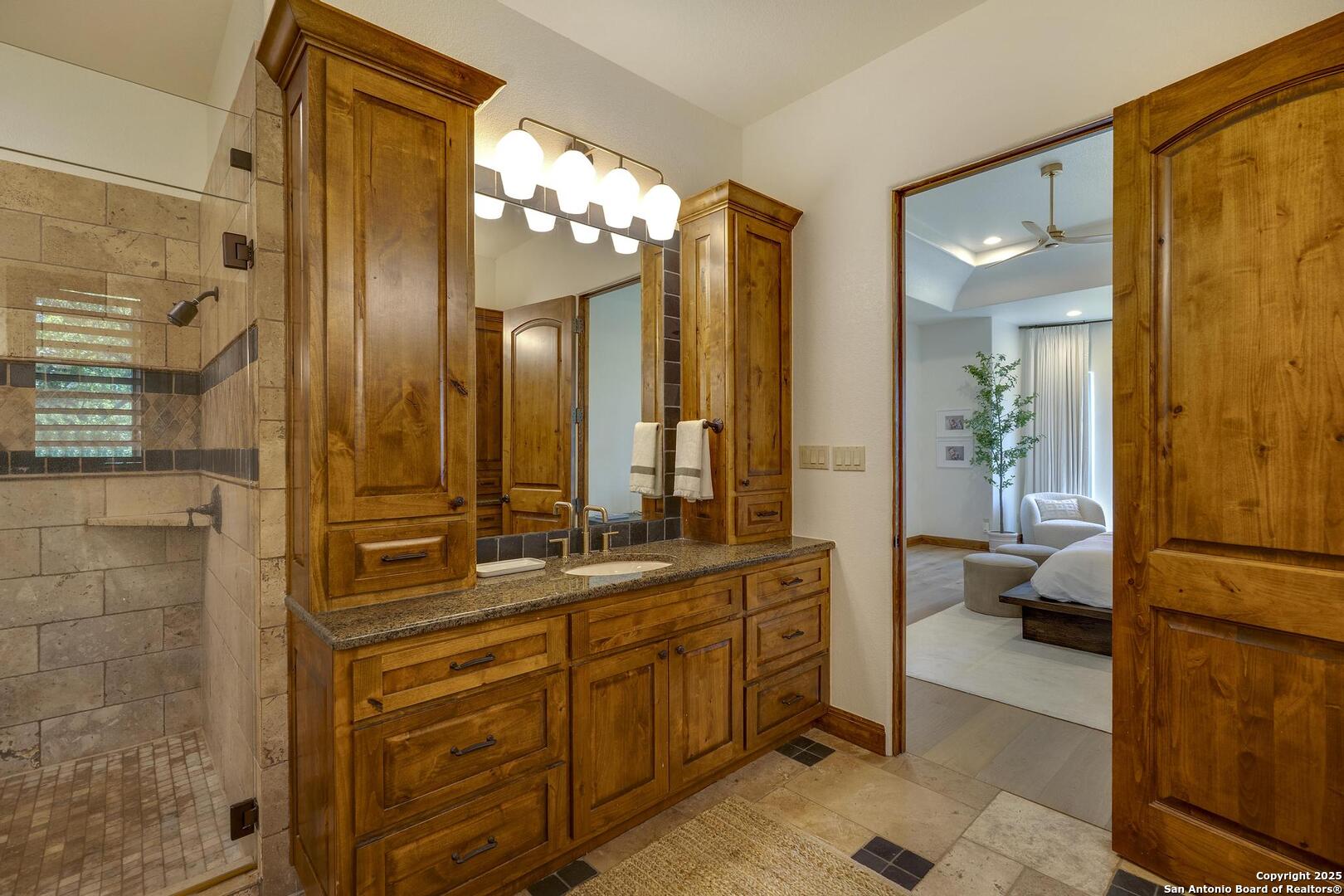 307 Augusta Boerne, TX 78006 - Photo 38 of 90 a bathroom with a double vanity sink and a mirror
