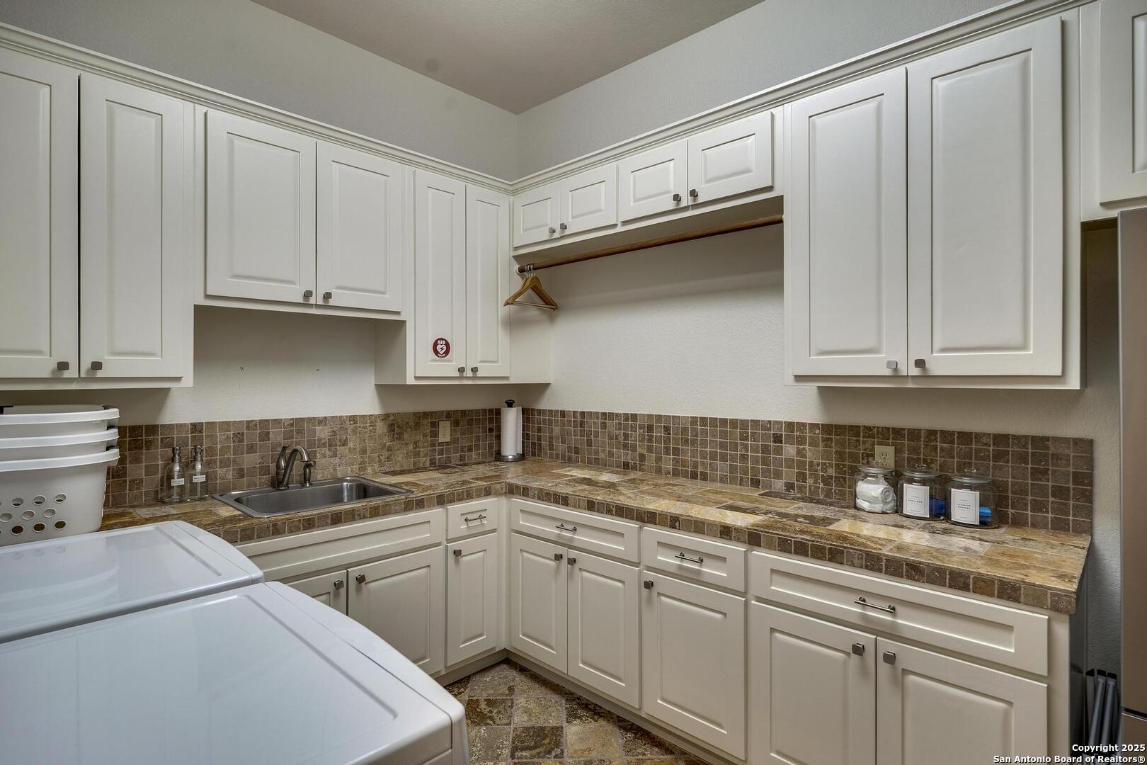 307 Augusta Boerne, TX 78006 - Photo 67 of 90 a kitchen with stainless steel appliances granite countertop white cabinets sink and dishwasher