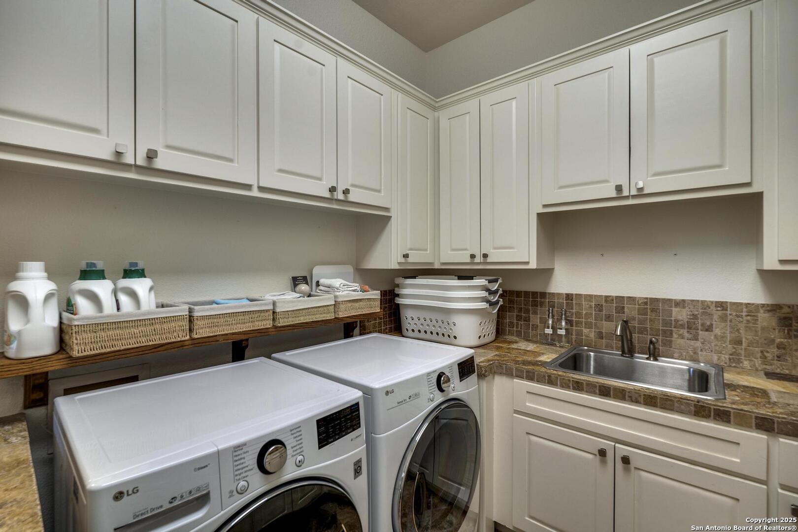 307 Augusta Boerne, TX 78006 - Photo 68 of 90 a utility room with dryer and washer