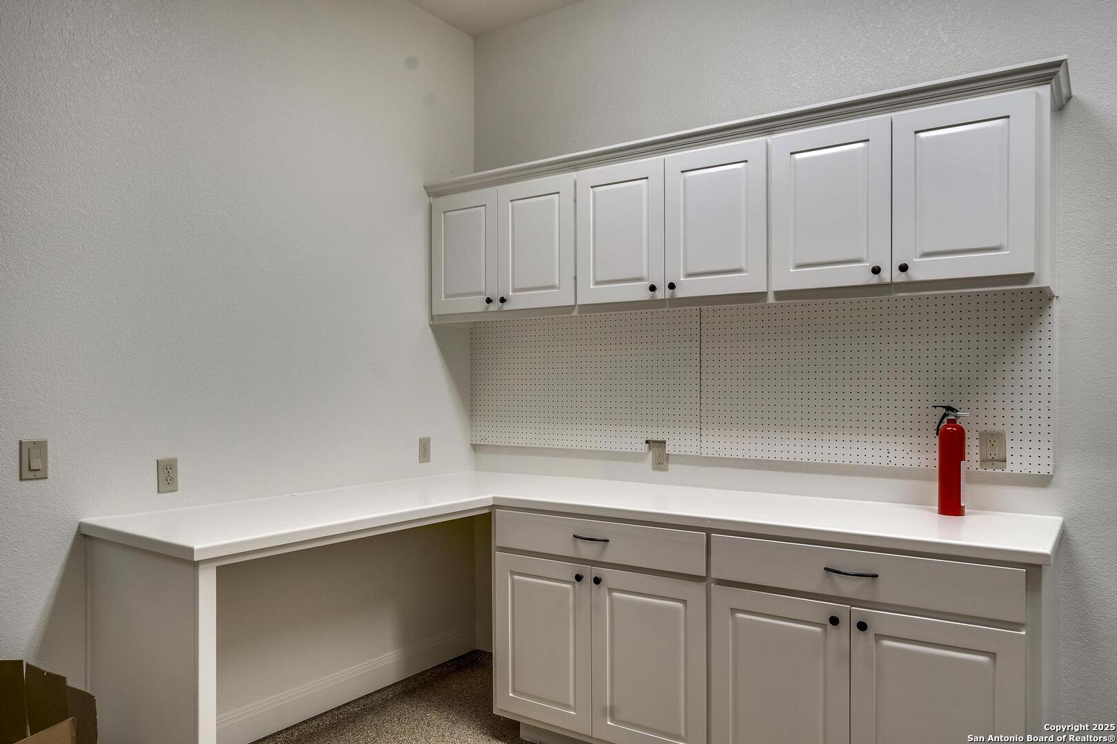 307 Augusta Boerne, TX 78006 - Photo 78 of 90 a kitchen with white cabinets and a sink