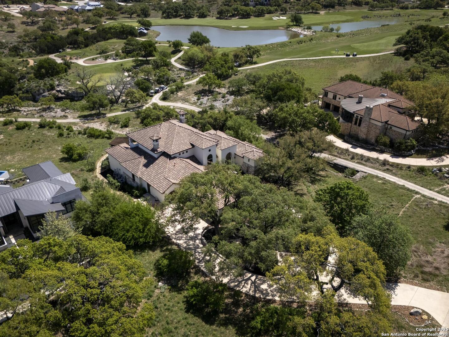 307 Augusta Boerne, TX 78006 - Photo 87 of 90 an aerial view of a house with a garden and lake view