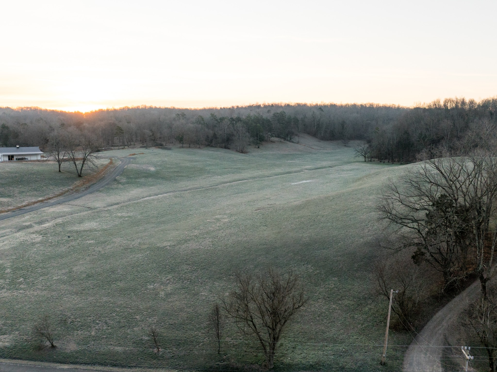 1 Pinewood Road Nunnelly, TN 37137 - Photo 1 of 10 a view of a field with trees in background