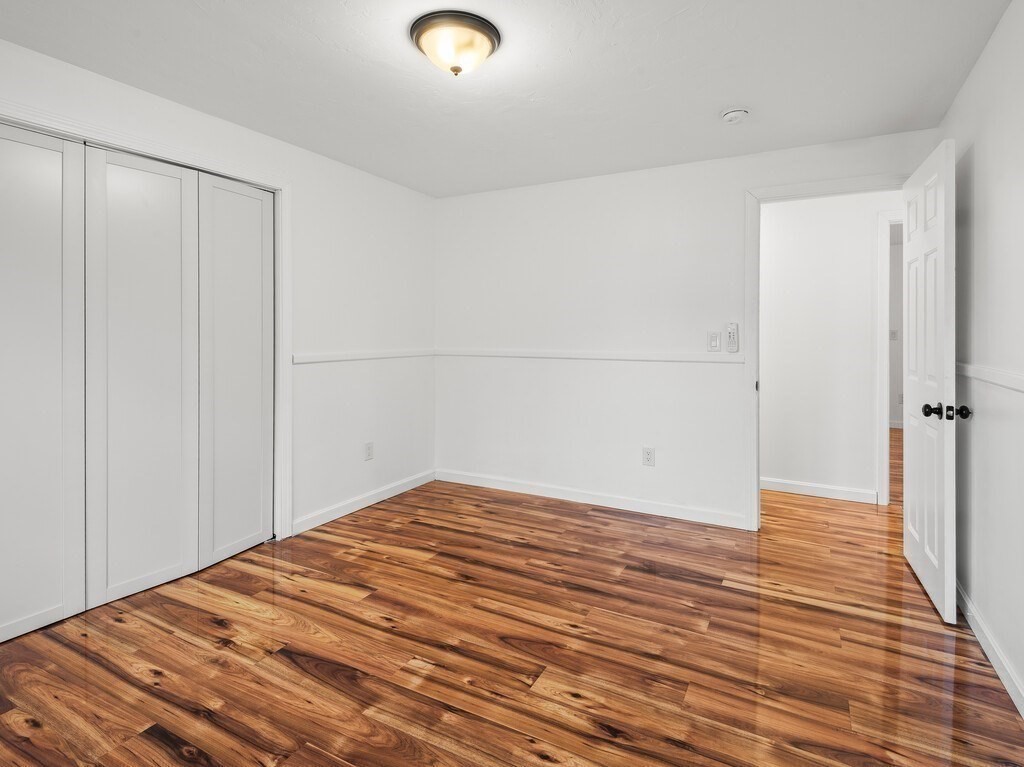 38 Hilda Street, Unit 1 Worcester, MA 01606 - Photo 12 of 38 a view of empty room with wooden floor