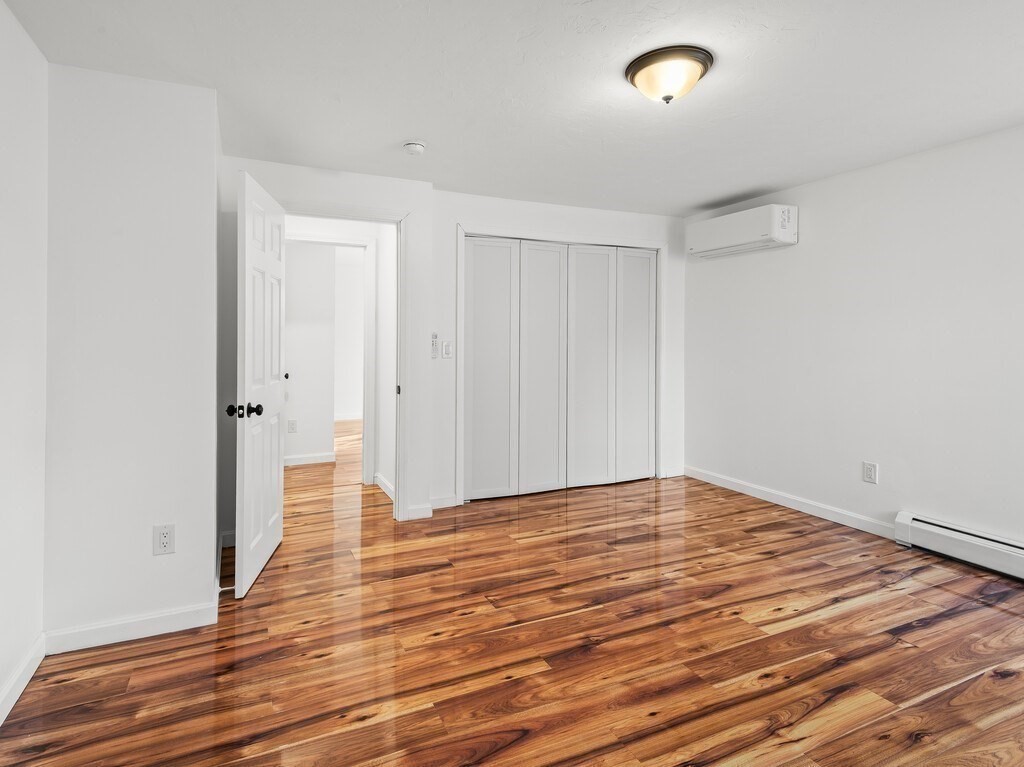 38 Hilda Street, Unit 1 Worcester, MA 01606 - Photo 14 of 38 a view of an empty room with wooden floor