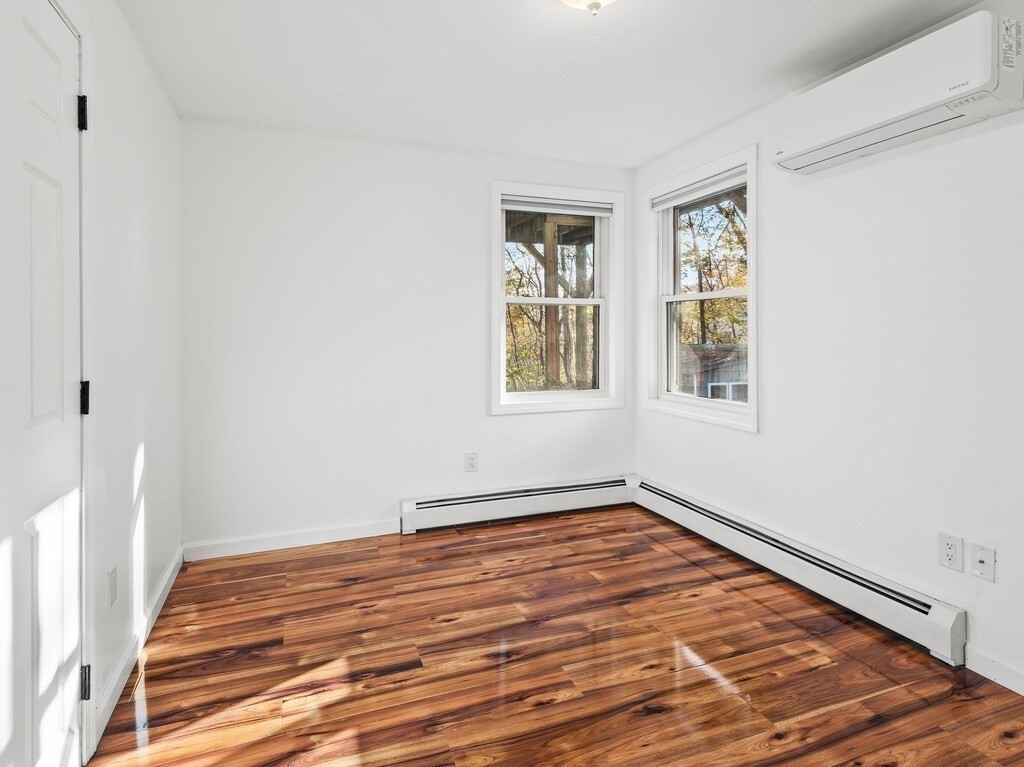 38 Hilda Street, Unit 1 Worcester, MA 01606 - Photo 15 of 38 a view of a room with wooden floor and windows