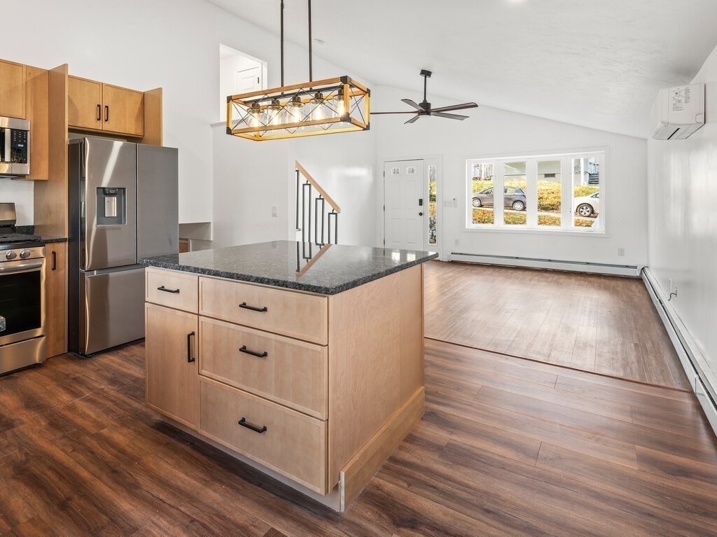 38 Hilda Street, Unit 1 Worcester, MA 01606 - Photo 6 of 38 a kitchen with stainless steel appliances granite countertop a refrigerator a stove and a sink