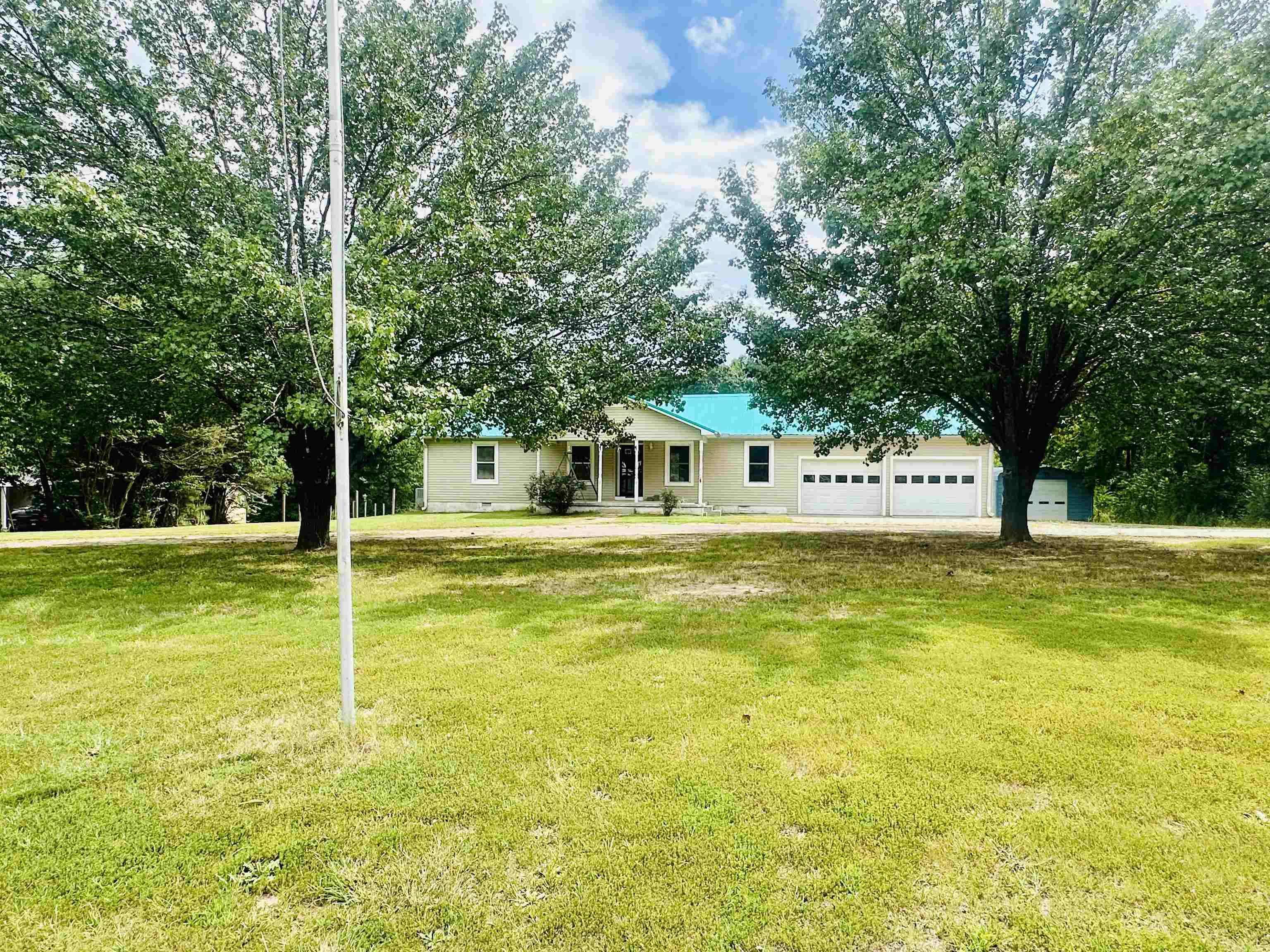 287 Gilchrist Stantonville Road Adamsville, TN 38310 - Photo 6 of 29 a house view with swimming pool in front of it