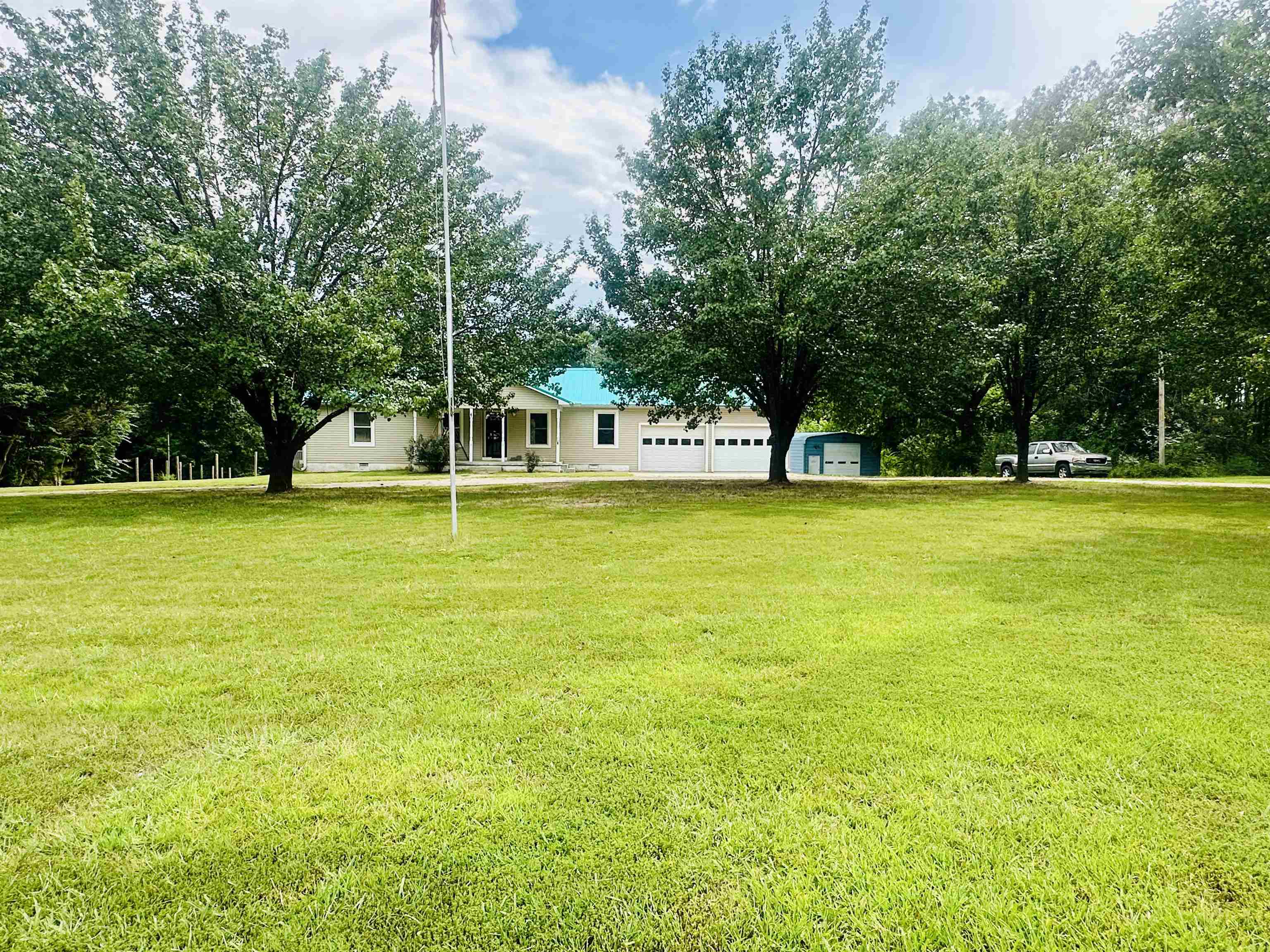 287 Gilchrist Stantonville Road Adamsville, TN 38310 - Photo 7 of 29 View of green lawn featuring view of scattered trees