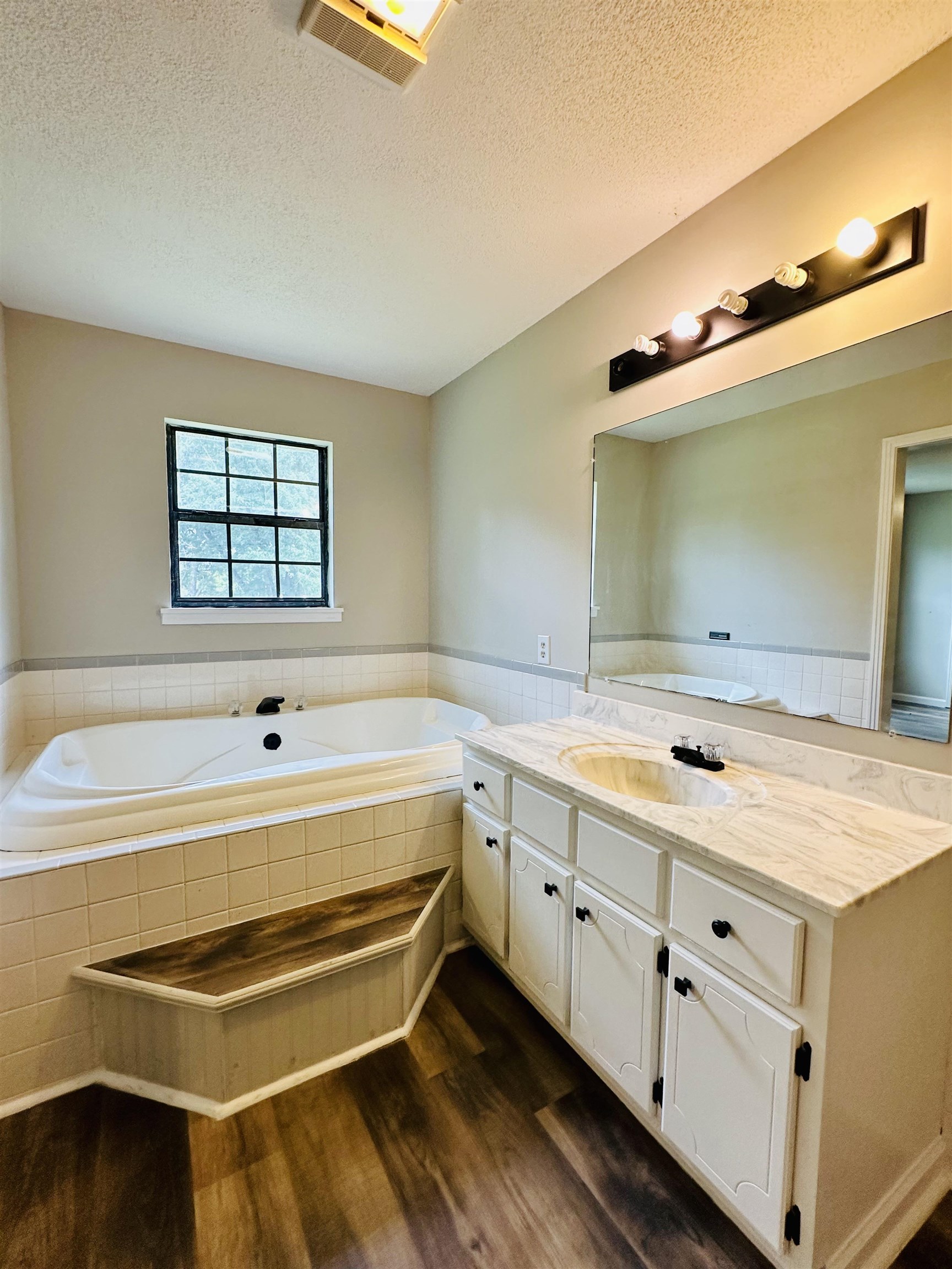 287 Gilchrist Stantonville Road Adamsville, TN 38310 - Photo 10 of 29 a bathroom with a tub sink and mirror