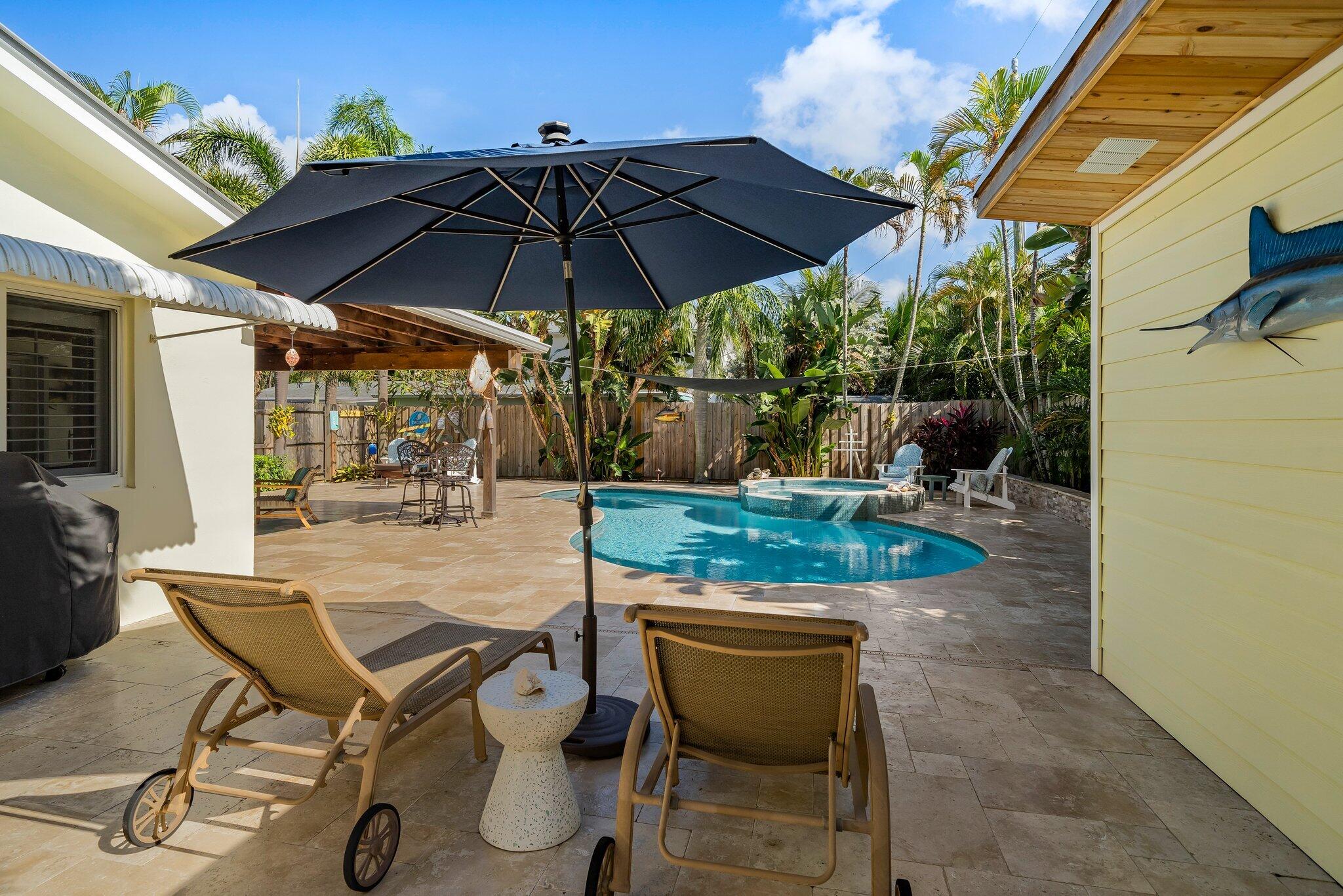 3410 Harbor Road South Jupiter, FL 33469 - Photo 32 of 60 3410 Harbor Rd S pool deck from pool hou