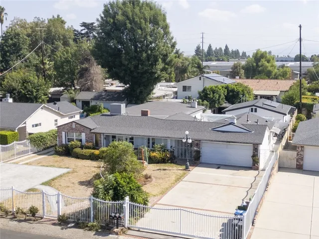 a aerial view of a house with a garden and plants