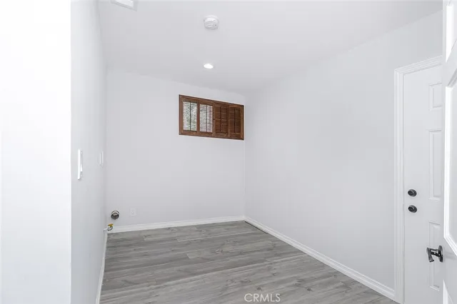 a view of a small space with wooden floor