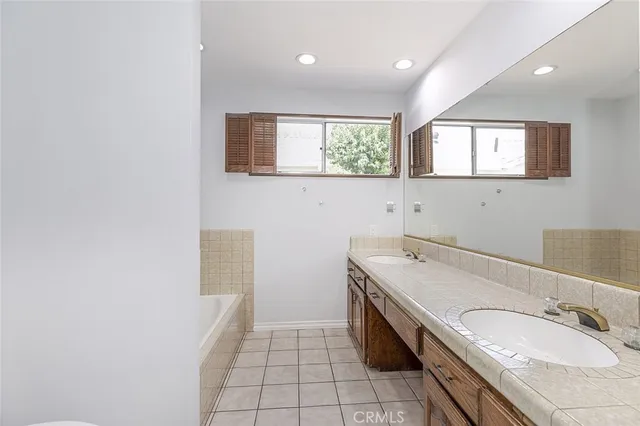 a bathroom with a sink a vanity and mirror