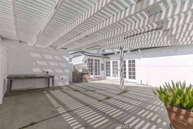 a bedroom with a bed and a table chair